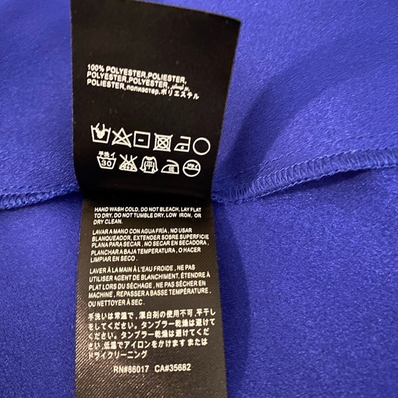 “BEBE” Brielle Bell Sleeve Asymmetrical Blouse - Picture 12 of 12